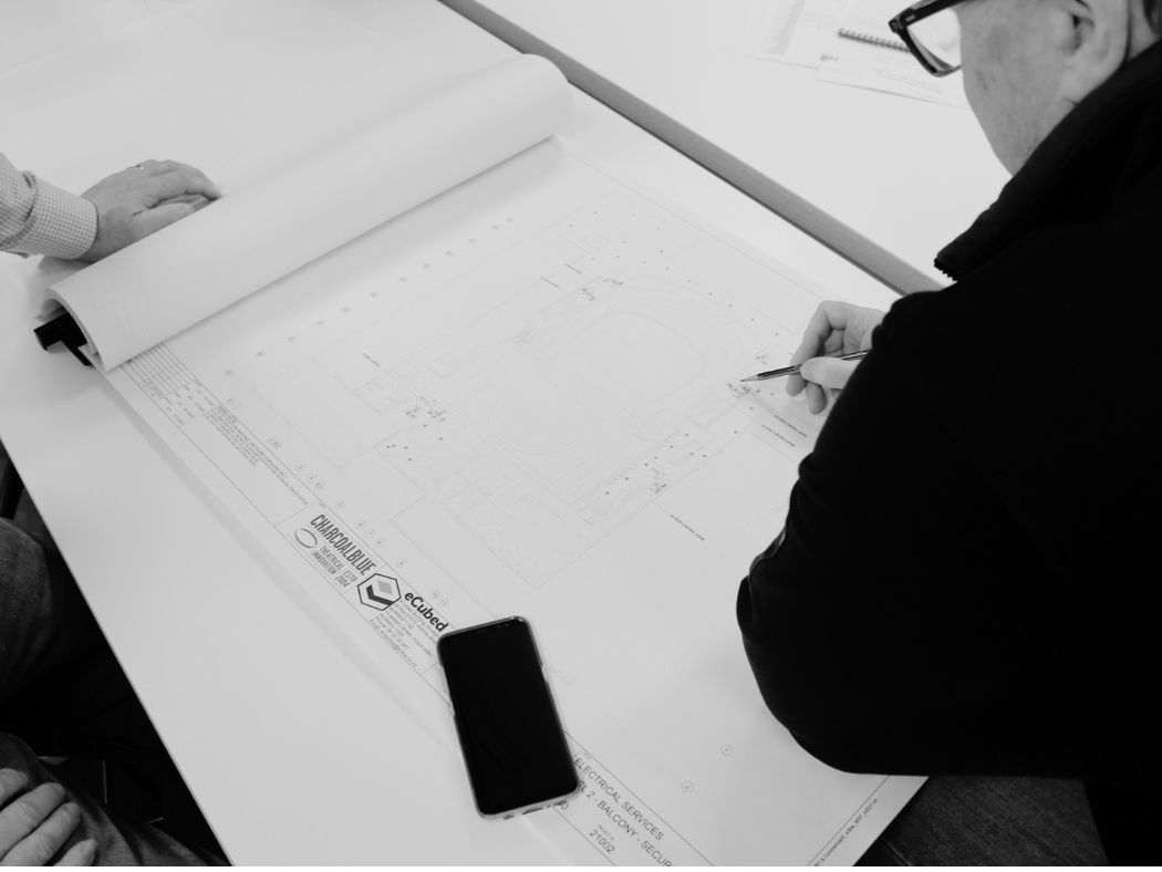 A man is drawing on paper